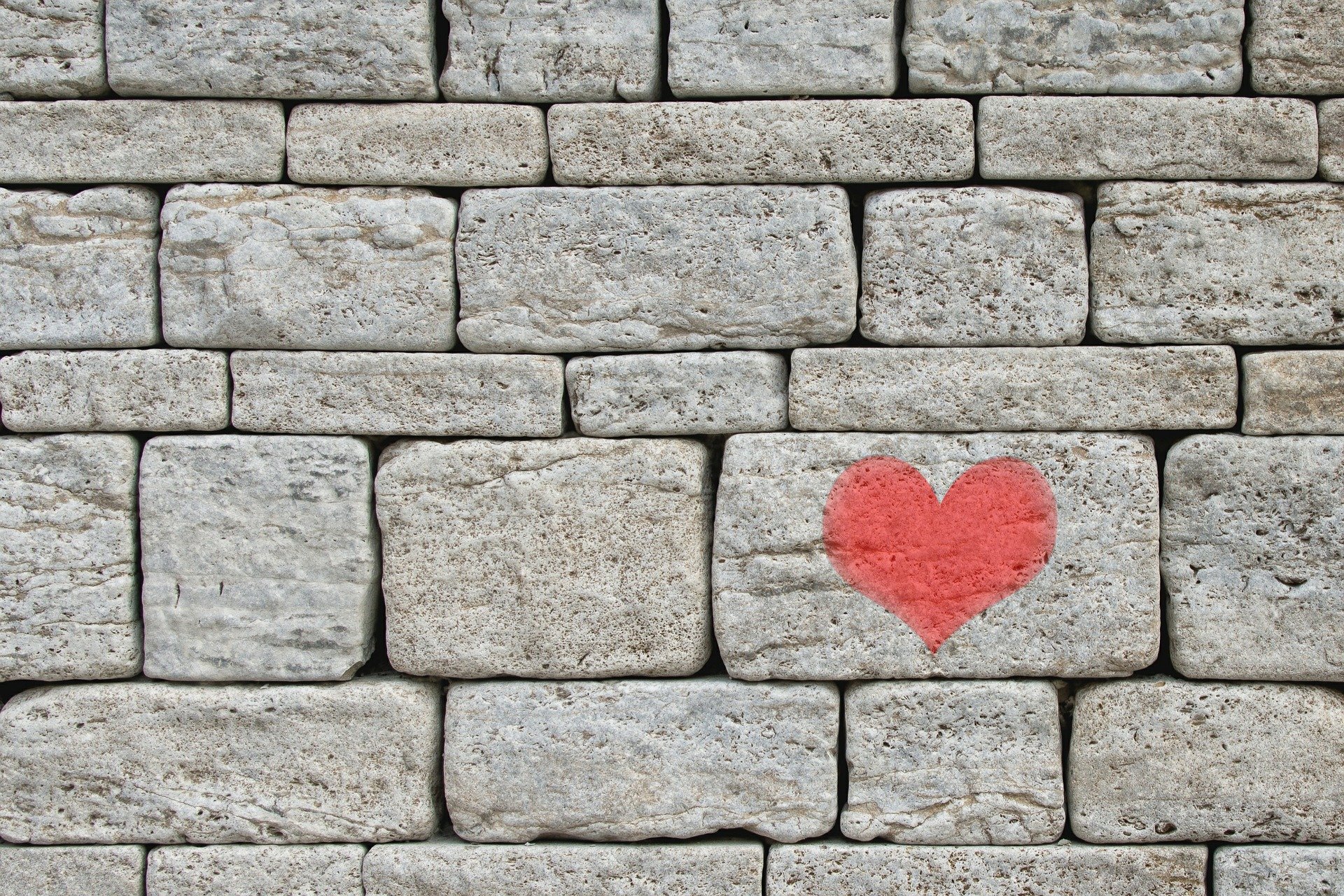 Painted red heart adorning stones