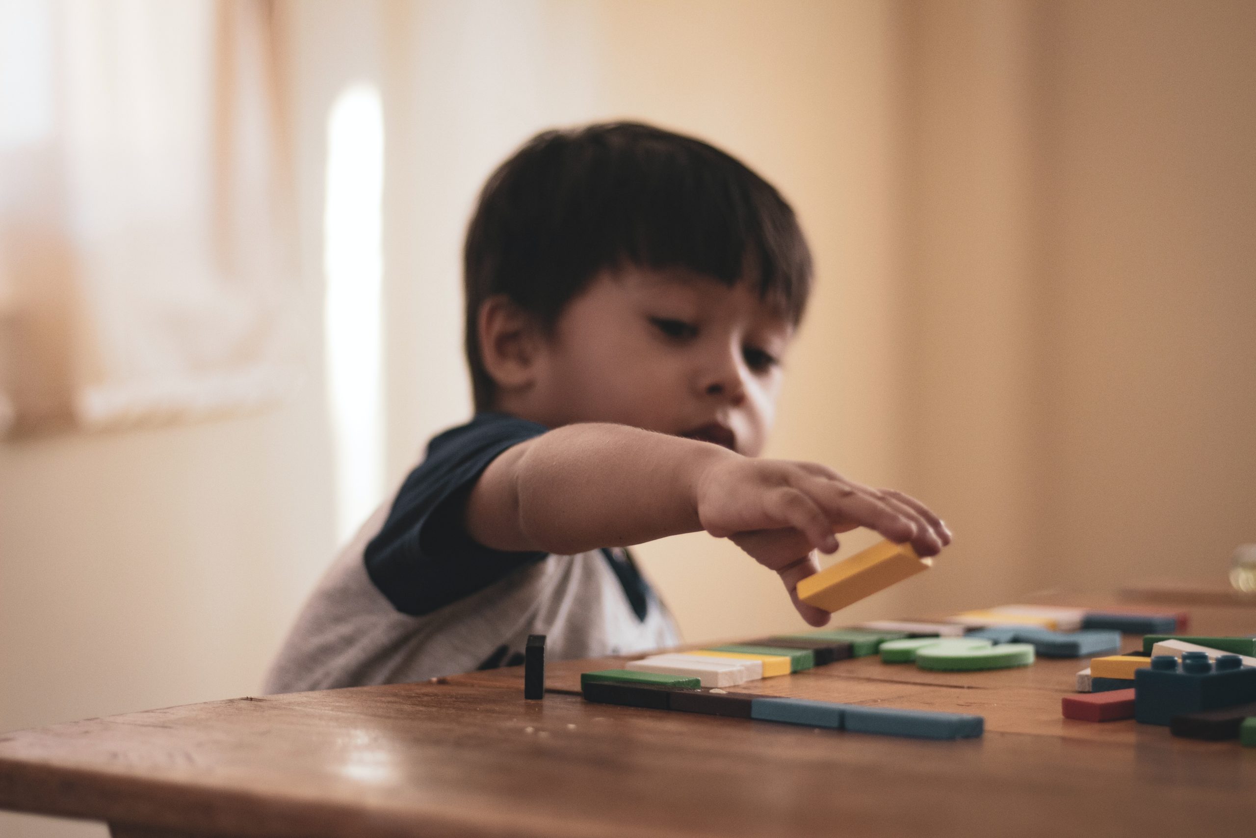 Child playing with building block toys