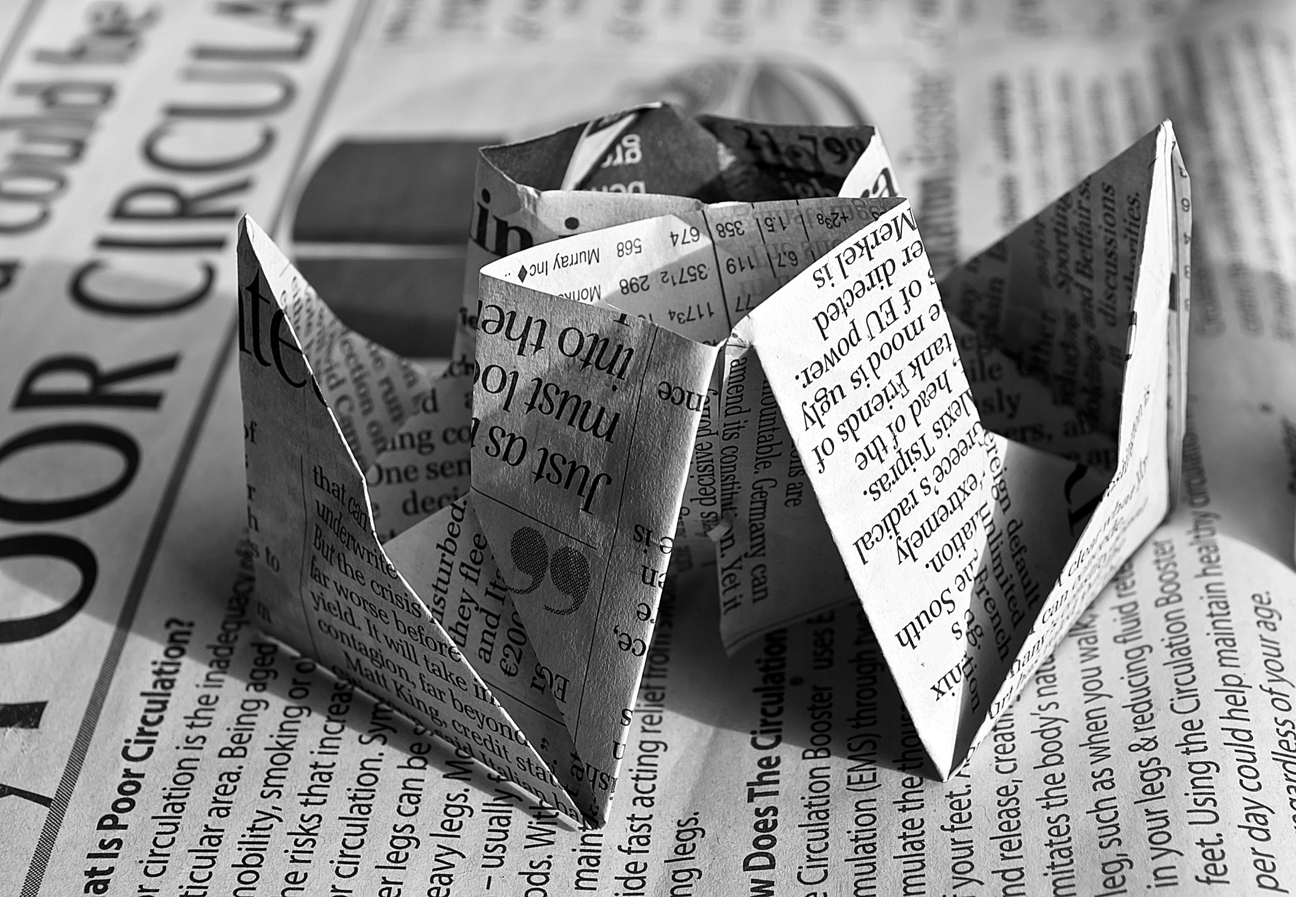 Newspaper folded in an origami fashion